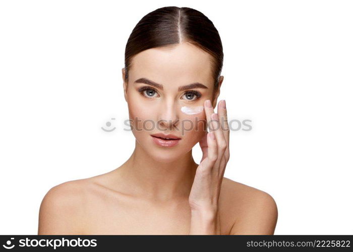 Beautiful Face of Young Woman with Clean Fresh Skin close up isolated on white. Beauty Portrait. Beautiful Spa Woman. Perfect Fresh Skin. Pure Beauty Model. Youth and Skin Care Concept. Beautiful Young Woman with Clean Fresh Skin