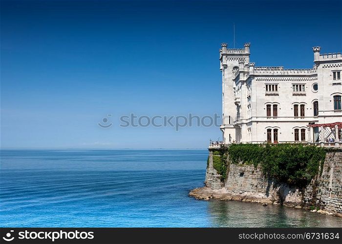 beautiful fairytale castle on the sea with copyspace