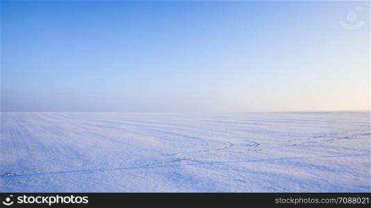 beautiful fallen white snow with blue sky on Sunny frosty day, winter season. beautiful fallen white snow