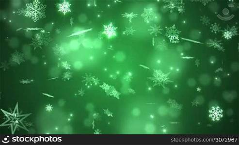 Beautiful falling snowflakes - green winter background. Seamless loop.