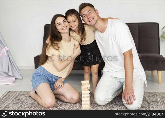 beautiful family laying floor game
