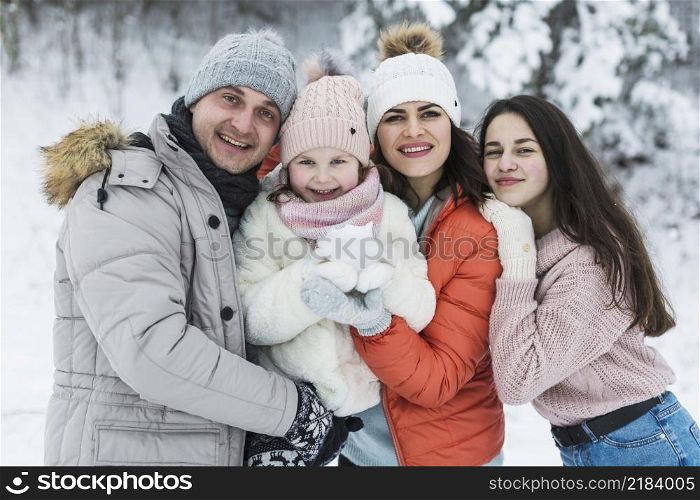 beautiful family posing camera