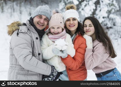 beautiful family posing camera