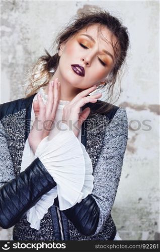 Beautiful fashion portrait of young woman model with sexy dark red lips make-up and wet messy hairstyle