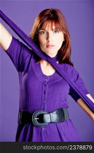 Beautiful fashion woman posing over a violet background