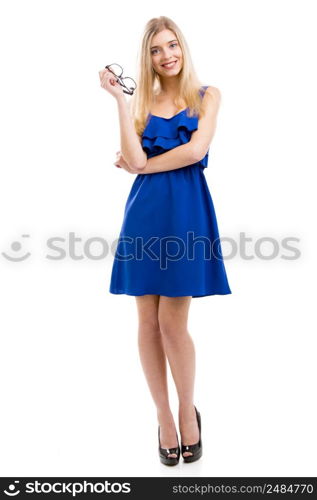 Beautiful fashion woman wearing a blue dress, isolated over white background