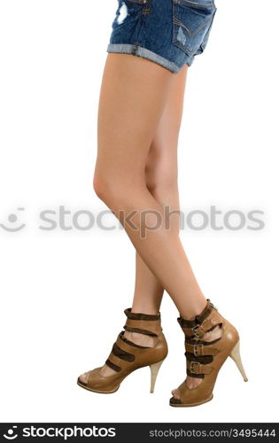 beautiful femail legs in shoes isolated on white