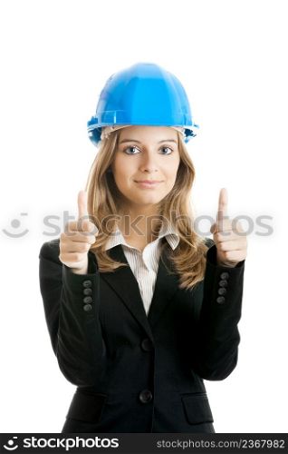 Beautiful female architect with thumbs up isolated on white