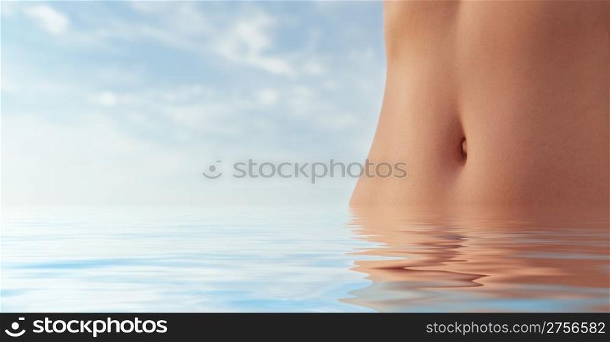 Beautiful female body in water. Blur sky background