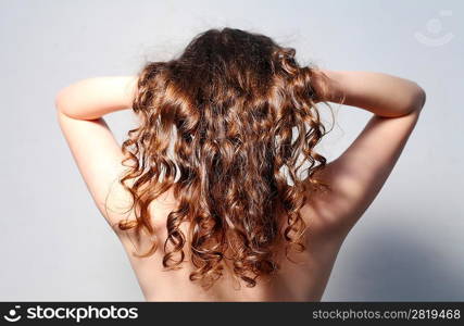 Beautiful female curly red hairs - back view