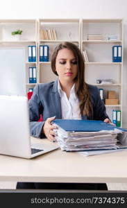 Beautiful female employee unhappy with excessive work 