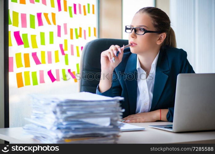 Beautiful female employee with many conflicting priorities 