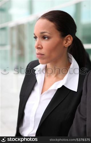 Beautiful female executive outside a corporate building