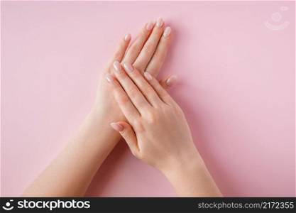 Beautiful female hands on a pink background. Spa and body care concept. Image for advertising.. Beautiful female hands on pink background. Spa and body care concept. Image for advertising.