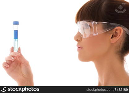 beautiful female lab worker holding up test tube