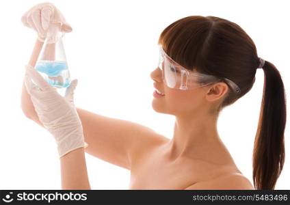 beautiful female lab worker holding up test tube