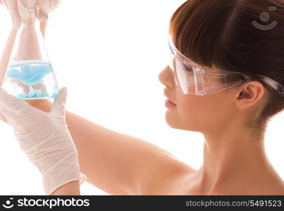 beautiful female lab worker holding up test tube