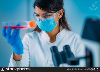 Beautiful Female Medicine or Molecular Biology Student in Laboratory