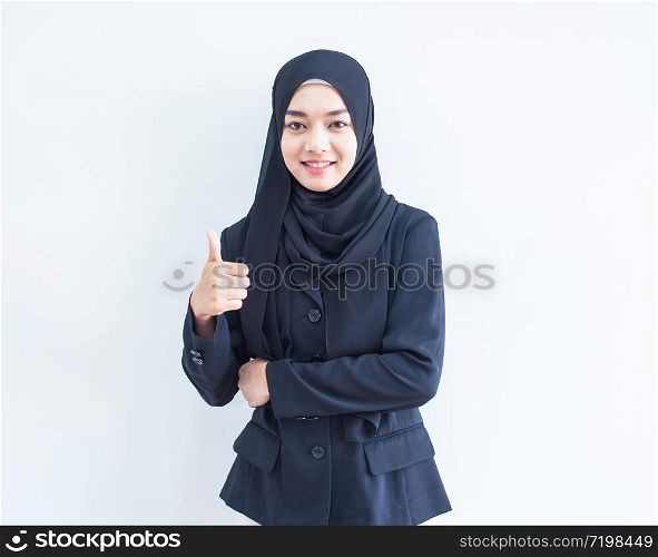 Beautiful female Muslim model in modern kurung and hijab, a modern lifestyle apparel for Muslim women isolated on white background. Beauty and hijab fashion concept. Half length portrait