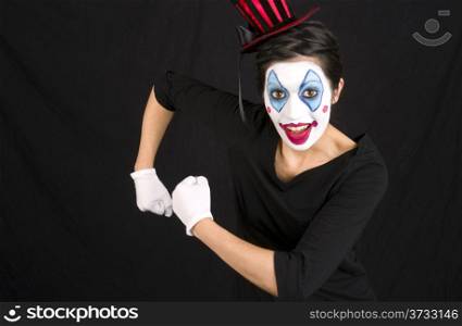 Beautiful Female show clown Megan does a mega man pose