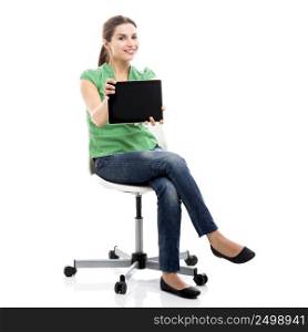 Beautiful female student sitting on a chair showing something on a tablet, isolated over a white background