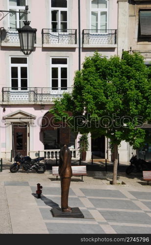 beautiful Fernando Pessoa statue in Sao Carlos square in Lisbon, Portugal