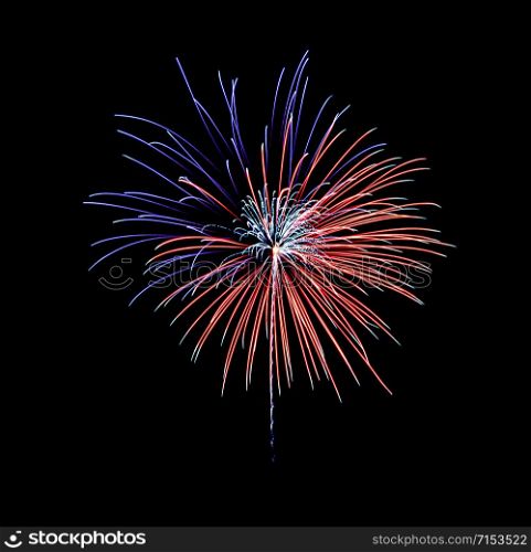 Beautiful festive blue and red fireworks display on night sky. New year and anniversary concept.