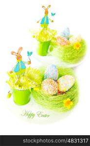 Beautiful festive Easter still life isolated on white background, colorful eggs, bunny toys, traditional Christian Eastertime symbol