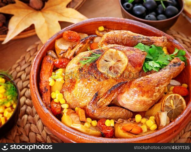Beautiful festive food still life, tasty crispy chicken with baked vegetables on the centerpiece of table, traditional family dinner in Thanksgiving day