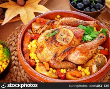 Beautiful festive food still life, tasty crispy chicken with baked vegetables on the centerpiece of table, traditional family dinner in Thanksgiving day