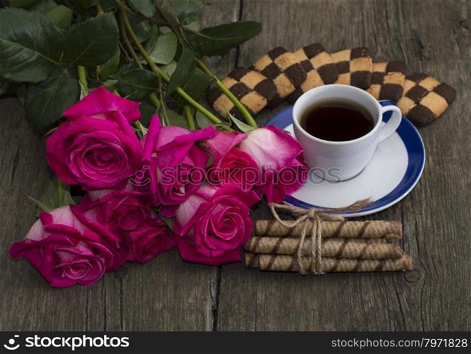 beautiful festive still life from flowers, cookies and coffee