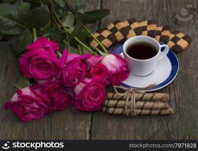 beautiful festive still life from flowers, cookies and coffee
