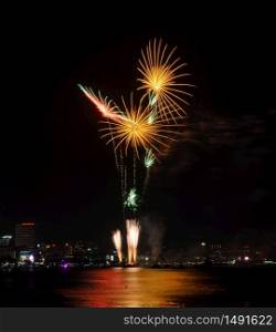 Beautiful firework at Pattaya coast with cityscape background, Thailand