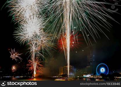Beautiful firework on the river for celebration on night background