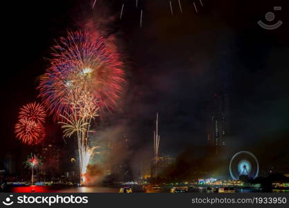 Beautiful firework on the river for celebration on night background