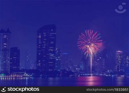 Beautiful firework on the river for celebration on night background