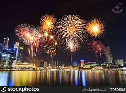beautiful firework over cityscape of Singapore city at night