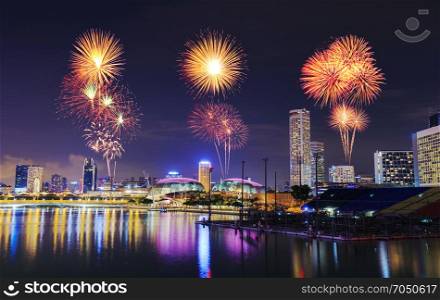 beautiful firework over cityscape of Singapore city at night