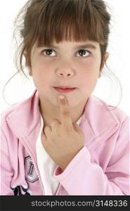 Beautiful five year old girl in pink thinking with finger on chin. Shot in studio over white.