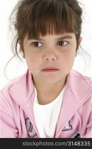 Beautiful five year old girl with sad expression. Shot in studio over white.