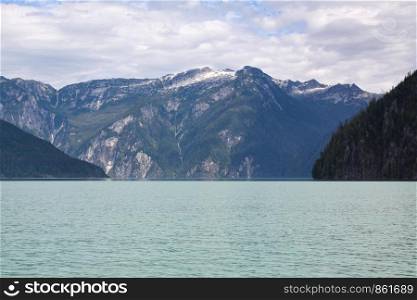 Beautiful fjord with turquoise water and snowy mountain