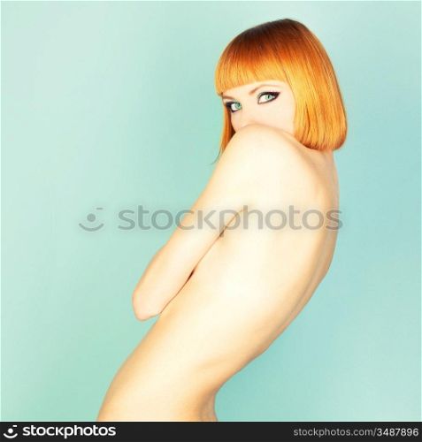 Beautiful flexible redhead girl with a bob haircut