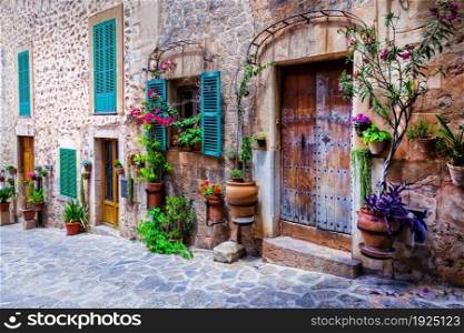 Beautiful floral streets with old doors and windows. Mediterranean culture and traditional villages