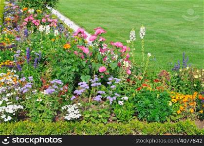 beautiful flower bed and green lawn