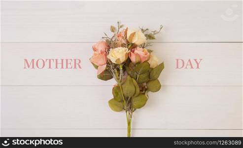Beautiful flower on wooden background with romantic, mother day or valentine day with pastel tone, spring or summer nature background for decoration, bouquet floral for gift on desk, holiday concept.