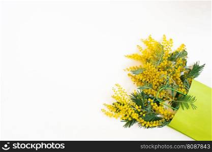 Beautiful flowers composition. Branches flowers mimosa on white background. Valentines Day, Easter, Birthday, Mother&rsquo;s day. Flat lay, top view, copy space