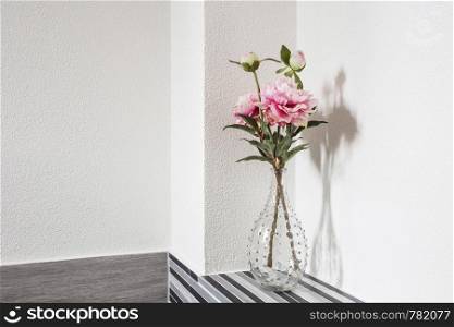 Beautiful flowers in glass vase on white background, closeup. Beautiful flowers in glass vase on white background,