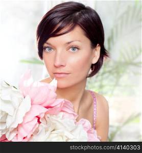 beautiful flowers woman with spring pink dress portrait
