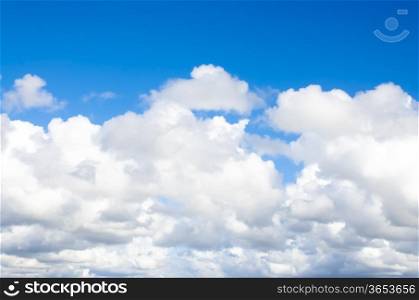 Beautiful fluffy white clouds on blue sky.