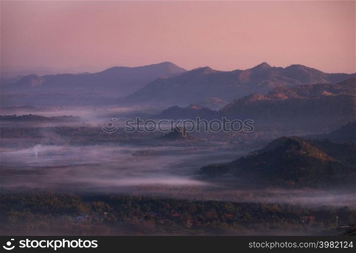 Beautiful fog in the morning forest with green mountains. Pang Puai, Mae Moh, Lampang, Thailand.. Fog in forest.